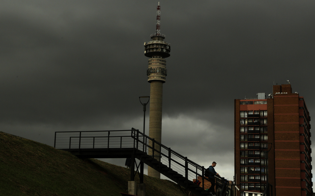 FILE - A man walks downstairs outside the Constitutional Court in Johannesburg, South Africa, on May 15, 2017. (AP Photo/Themba Hadebe, File)