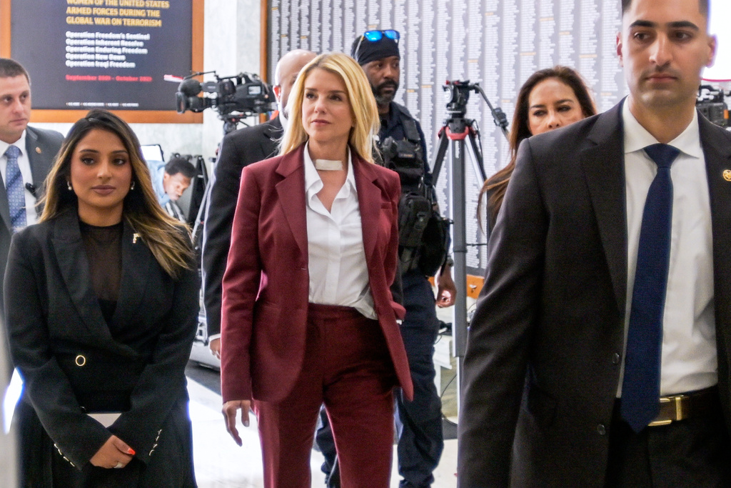 Former Attorney General Pam Bondi, center, arrives for her deposition at the Rayburn House Office Building on Capitol Hill, Friday, May 29, 2026, in Washington. (AP Photo/Rod Lamkey, Jr.)