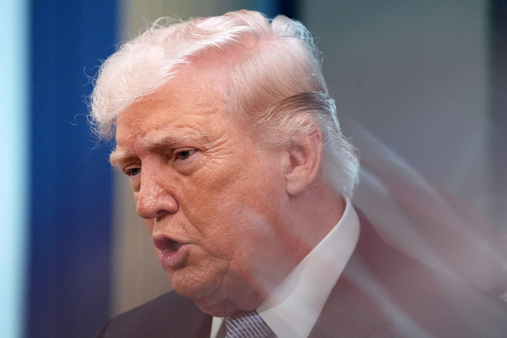 A zoom lens and slow shutter speed technique shows President Donald Trump speaking with reporters in the James Brady Press Briefing Room at the White House, Monday, April 6, 2026, in Washington.(AP Photo/Alex Brandon)