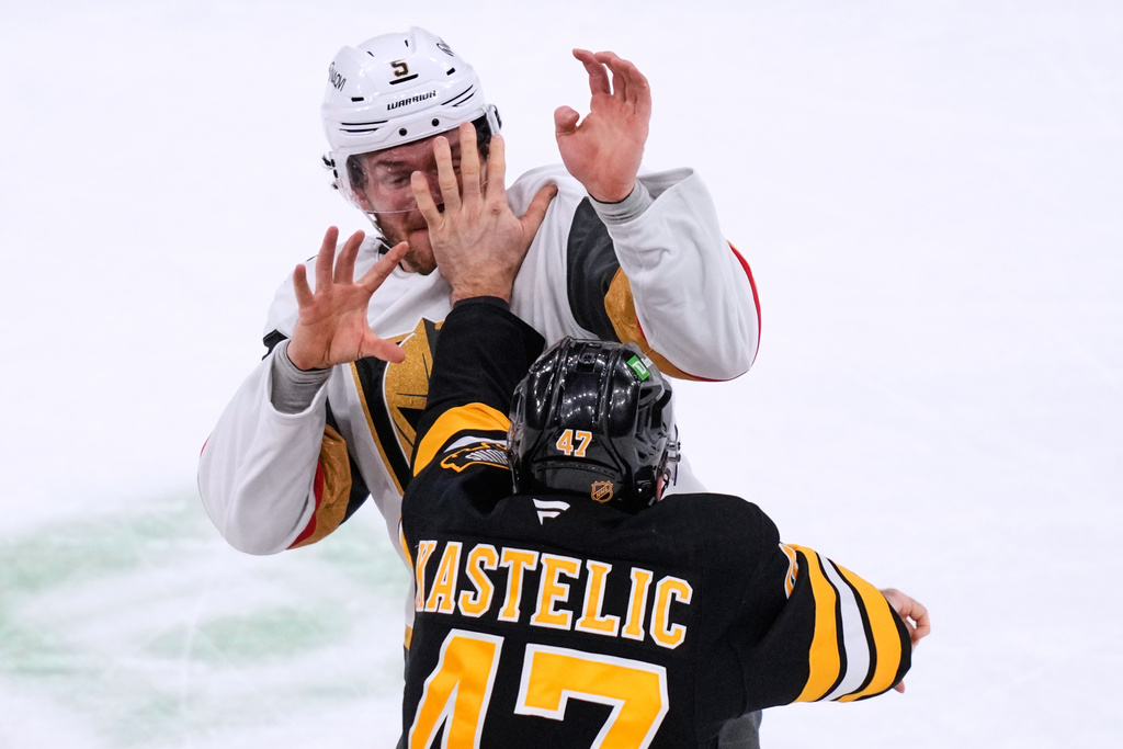 Vegas Golden Knights defenseman Jeremy Lauzon, rear, fights Boston Bruins center Mark Kastelic (47) during the first period of an NHL hockey game, Thursday, Jan. 22, 2026, in Boston. (AP Photo/Charles Krupa)