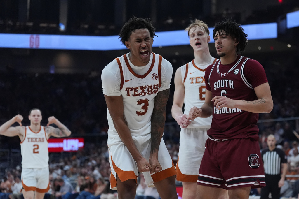 Texas forward Dailyn Swain (3) reacts to a score against South Carolina during the second half of an NCAA college basketball game in Austin, Texas, Feb. 3, 2026. (AP Photo/Eric Gay)