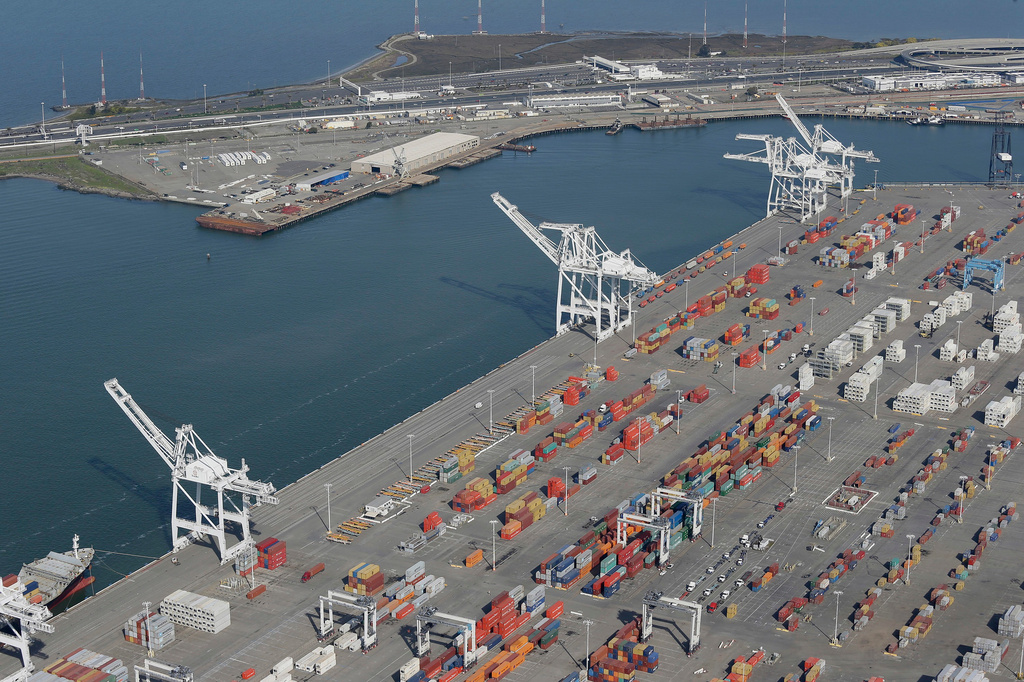 The former Oakland Army Base pier at left and the Port of Oakland at lower right, are pictured in Oakland, Calif., Feb. 5, 2016. (AP Photo/Eric Risberg, File)