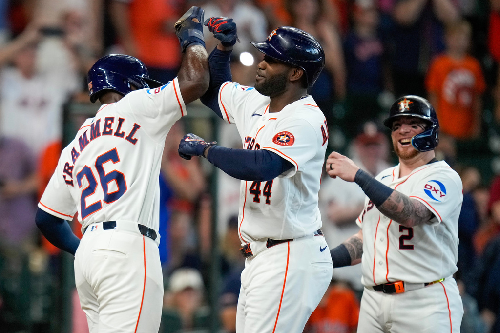 Houston Astros designated hitter Yordan Alvarez, center, celebrates after his grand slam against the Athletics with Taylor Trammell (26) during the second inning of a baseball game, Saturday, June 6, 2026, in Houston. (AP Photo/Eric Christian Smith)