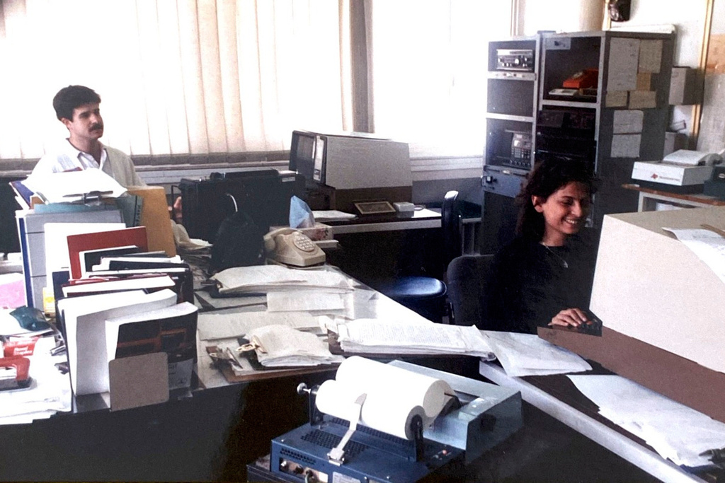 This handout photo provided by Hasan Mroue, shows Mona Ziade, right, and Mroue at work in the AP Middle East head office in Nicosia, Cyprus in the late 1980s. (Hasan Mroue via AP)