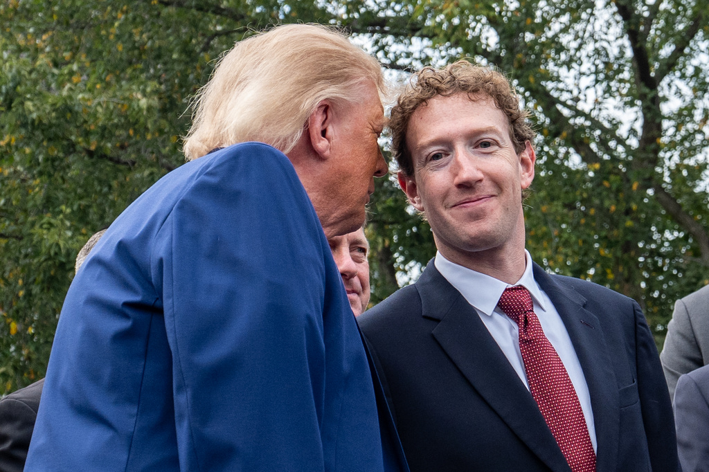 President Donald Trump talks with Meta CEO Mark Zuckerberg as he speaks with reporters outside the West Wing of the White House, Tuesday, Sept. 29, 2026, in Washington. (AP Photo/Alex Brandon)