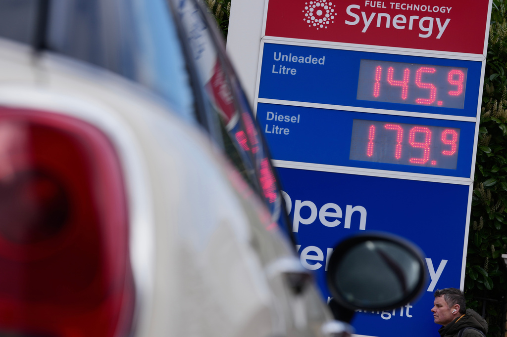 FILE - Prices are shown on a board at a gas station in London, England, Monday, March 30, 2026. (AP Photo/Kin Cheung, File)