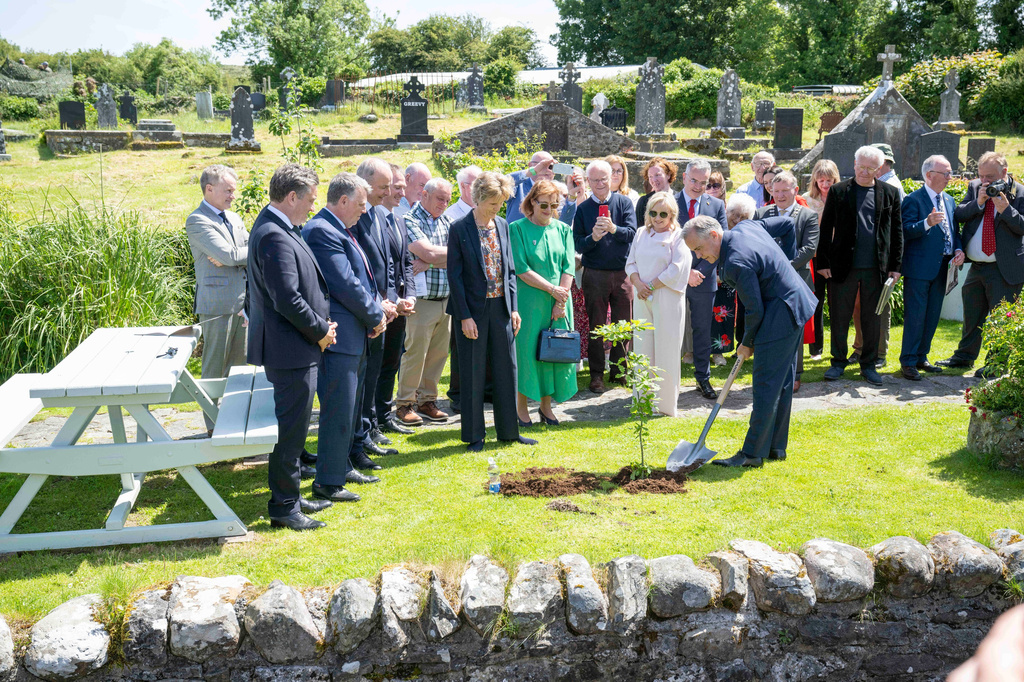 Canadian Prime Minister Mark Carney plants an oak tree during a visit to Aughagower, Ireland, Sunday, June 14, 2026. (Andrew Downes/PA via AP)