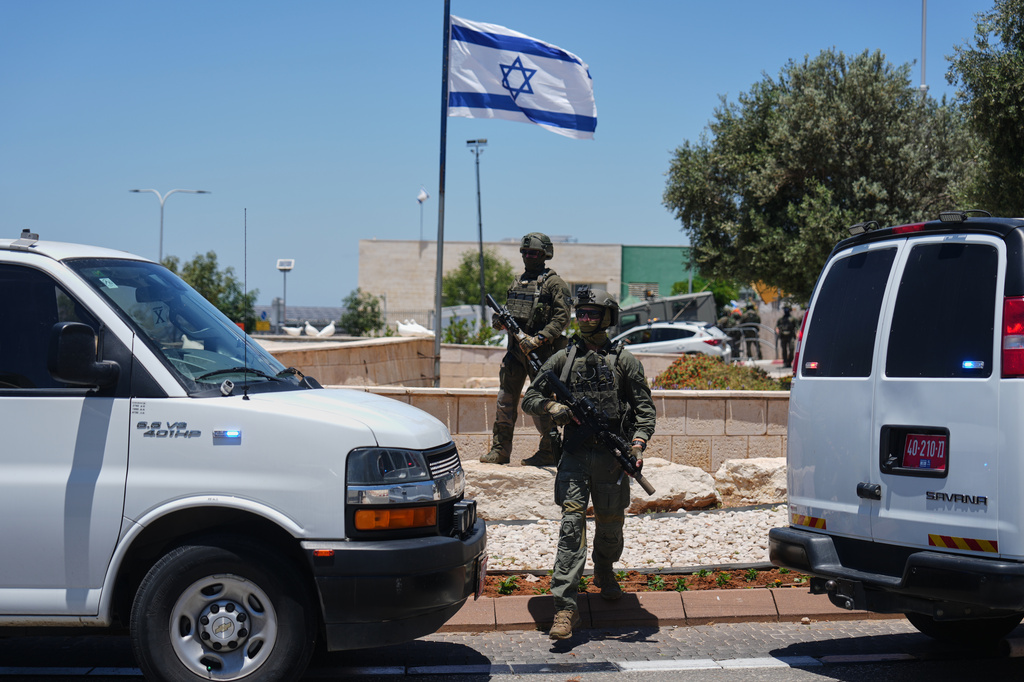 Israeli security forces are deployed at the scene of a shooting attack carried out by a Palestinian citizen of Israel near Tzur Yitzhak in central Israel, Sunday, June 7, 2026. (AP Photo/Ariel Schalit)