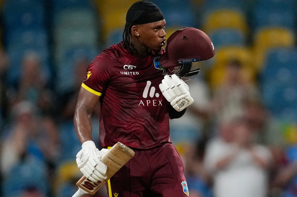 FILE - West Indies' Keacy Carty celebrates after he scored a century against England during the third ODI cricket match at Kensington Oval in Bridgetown, Barbados, Nov. 6, 2024. (AP Photo/Ricardo Mazalan, File)
