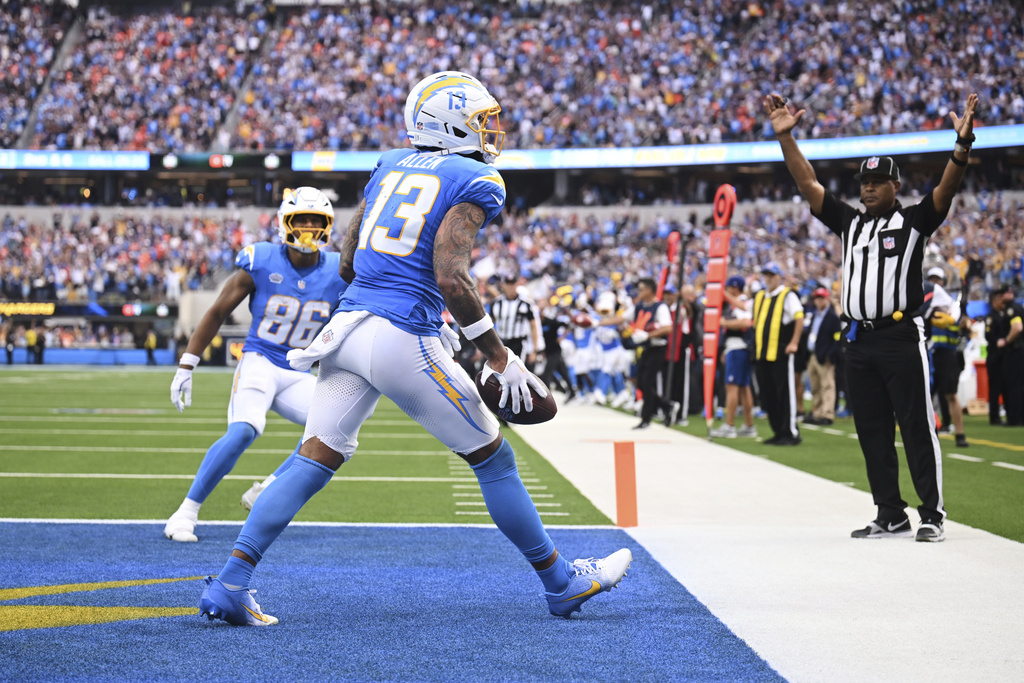 Los Angeles Chargers wide receiver Keenan Allen (13) celebrates his touchdown catch during the second half an NFL football game against the Denver Broncos, Sunday, Sept. 21, 2025, in Inglewood, Calif. (AP Photo/Carrie Giordano)