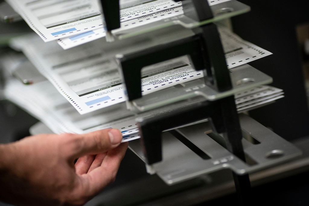 FILE - Poll workers sort ballots at the Kenosha Municipal Building on Election Day, Nov. 3, 2020, in Kenosha, Wis. (AP Photo/Wong Maye-E, File)