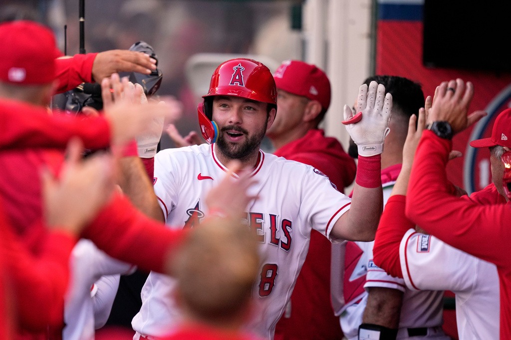 Los Angeles Angels' Nolan Schanuel is congratulated by teammates in the dugout after hitting a two-run home run during the first inning of a baseball game against the Athletics, Thursday, May 21, 2026, in Anaheim, Calif. (AP Photo/Mark J. Terrill)