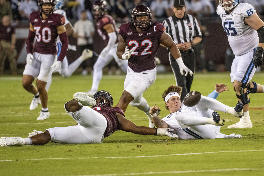 Old Dominion quarterback Colton Joseph (1) recovers a fumble against Virginia Tech during the first half of an NCAA college football game Saturday, Sept. 13, 2025, in Blacksburg, Va. (AP Photo/Robert Simmons)
