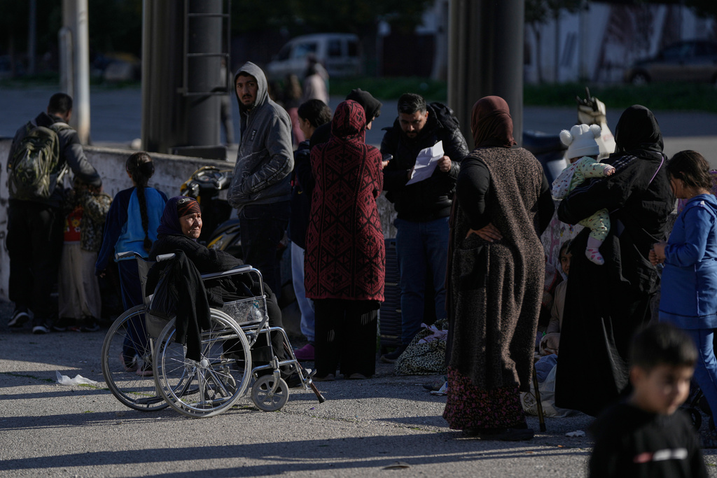 Displaced families gather in Martyrs' Square after fleeing Israeli airstrikes in Dahiyeh, a southern suburb of Beirut, Lebanon, Monday, March 2, 2026. (AP Photo/Bilal Hussein)