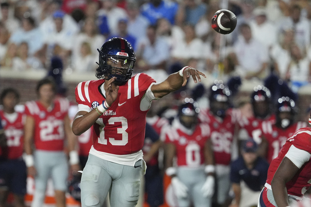 Mississippi quarterback Austin Simmons (13) passes against Georgia State during the first half of an NCAA college football game in Oxford, Miss., Saturday, Aug. 30, 2025. (AP Photo/Rogelio V. Solis)
