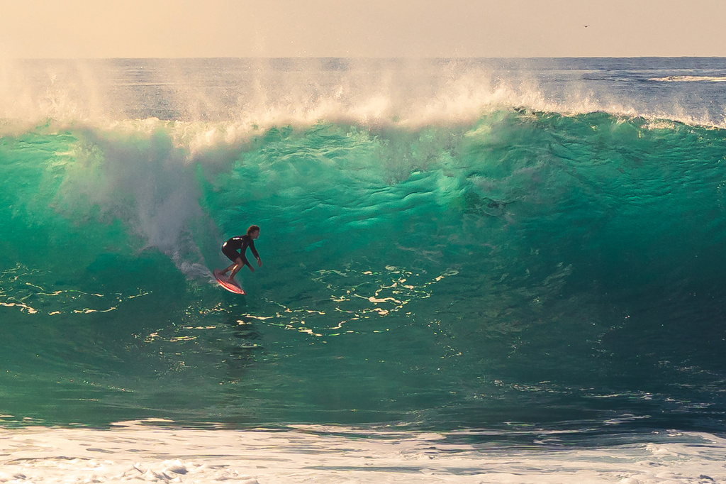 This photo provided by Steve Hague shows a surfer at Newport Beac, Saturday, Sept. 5, 2026, in Newport Beach, Calif. (Steve Hague via AP)