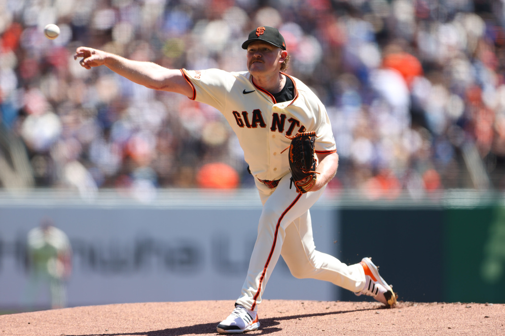 San Francisco Giants pitcher Logan Webb throws to a Chicago Cubs batter during the first inning of a baseball game Sunday, June 14, 2026, in San Francisco. (AP Photo/Scott Marshall)