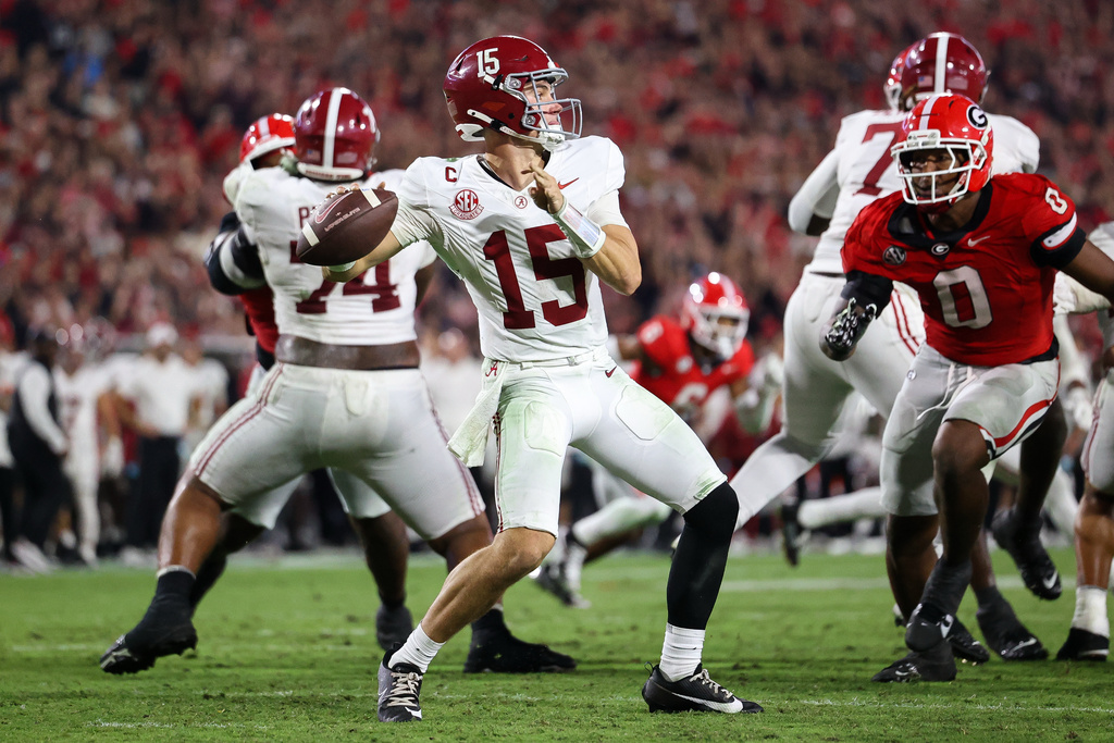 Alabama Crimson Tide quarterback Ty Simpson (15) throws a pass during the second half of an NCAA college football game against Georgia, Saturday, Sept. 27, 2025, in Athens, Ga. (AP Photo/Colin Hubbard)