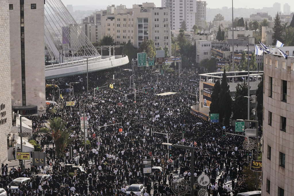 Ultra-Orthodox Jewish men attend a rally against plans to force them to serve in the Israeli military, in Jerusalem, Thursday, Oct. 30, 2025. (AP Photo/Mahmoud Illean)