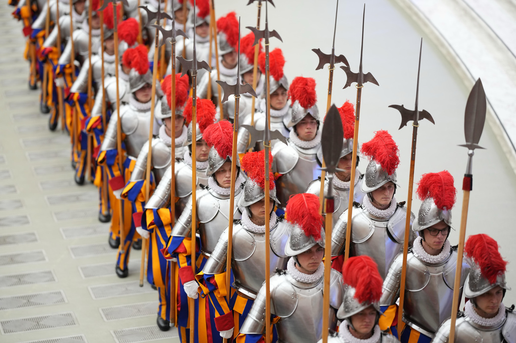 Cadets arrive at the swearing in ceremony for 28 new Pontifical Swiss Guards in the Paul VI Hall at the Vatican, Wednesday, May 6, 2026. (AP Photo/Andrew Medichini)