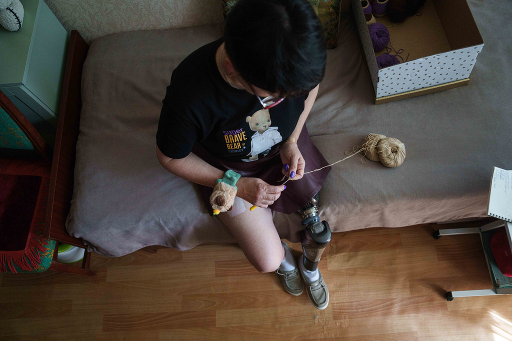 Iryna Nakonechna knits a toy capybara at her home in Kryvyi Rih, Ukraine, Friday, May 8, 2026. (AP Photo/Evgeniy Maloletka)