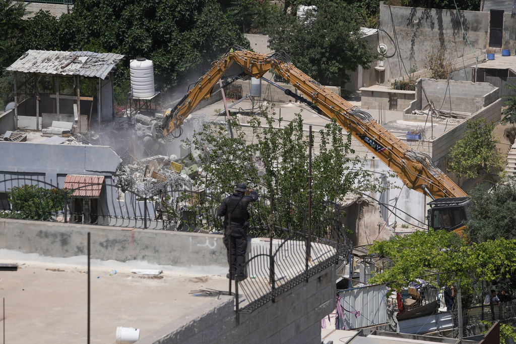 Israeli authorities demolish a Palestinian home in the Silwan neighborhood of east Jerusalem, May 25, 2026. (AP Photo/Mahmoud Illean)