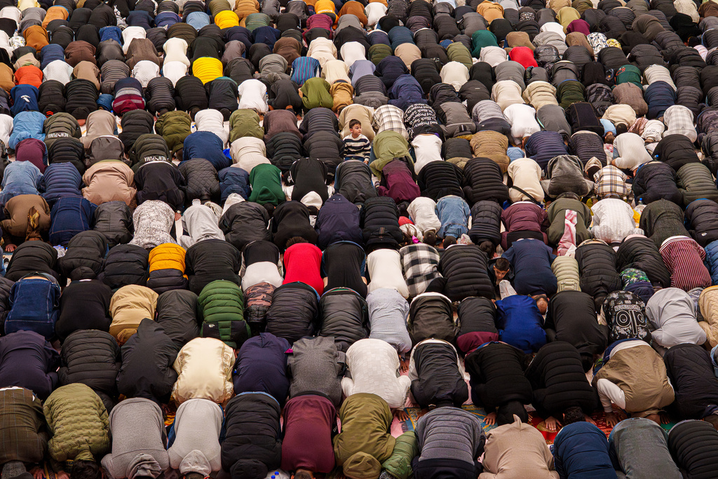 Muslims attend Eid al-Fitr prayers in a sports hall in Bucharest, Romania, Friday, March 20, 2026. (AP Photo/Vadim Ghirda)