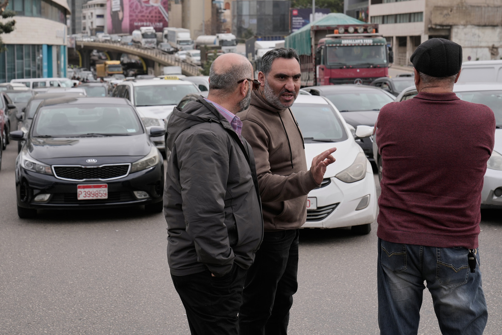 Taxi drivers block a main highway with their cars during a protest against the increased taxes and gasoline prices issued by the Lebanese Cabinet on Monday, in Beirut, Lebanon, Tuesday, Feb. 17, 2026. (AP Photo/Hussein Malla)