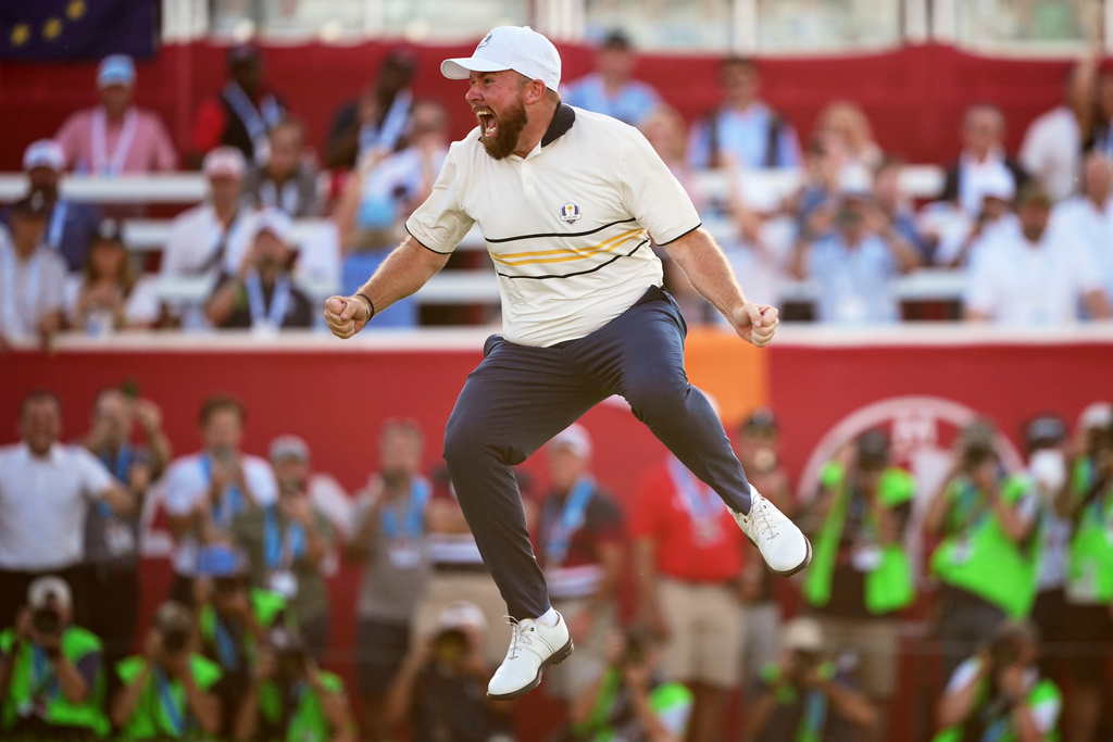 Europe's Shane Lowry celebrates after making the winning putt putt on the 18th hole during their singles match on the Bethpage Black golf course at the Ryder Cup golf tournament, Sunday, Sept. 28, 2025, in Farmingdale, N.Y. (AP Photo/Matt Slocum)