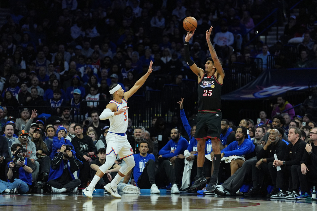 Philadelphia 76ers' Dominick Barlow goes up to shoot against New York Knicks' Josh Hart during the first half of an NBA basketball game, Wednesday, Feb. 11, 2026, in Philadelphia. (AP Photo/Matt Rourke)