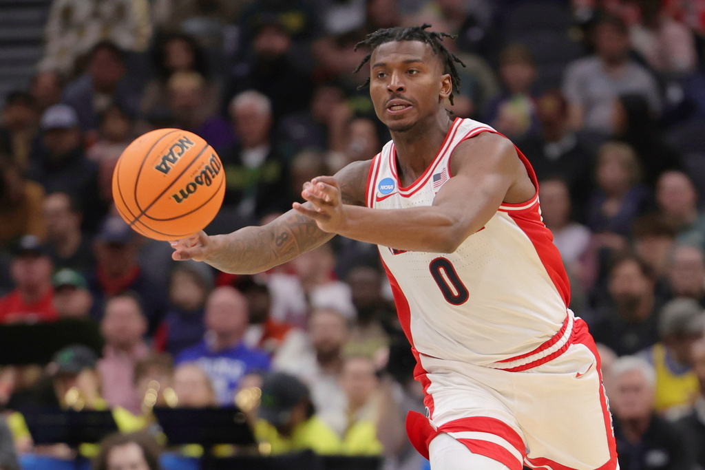 FILE - Arizona guard Jaden Bradley passes against Akron during the second half in the first round of the NCAA college basketball tournament, Friday, March 21, 2025, in Seattle. (AP Photo/Ryan Sun)