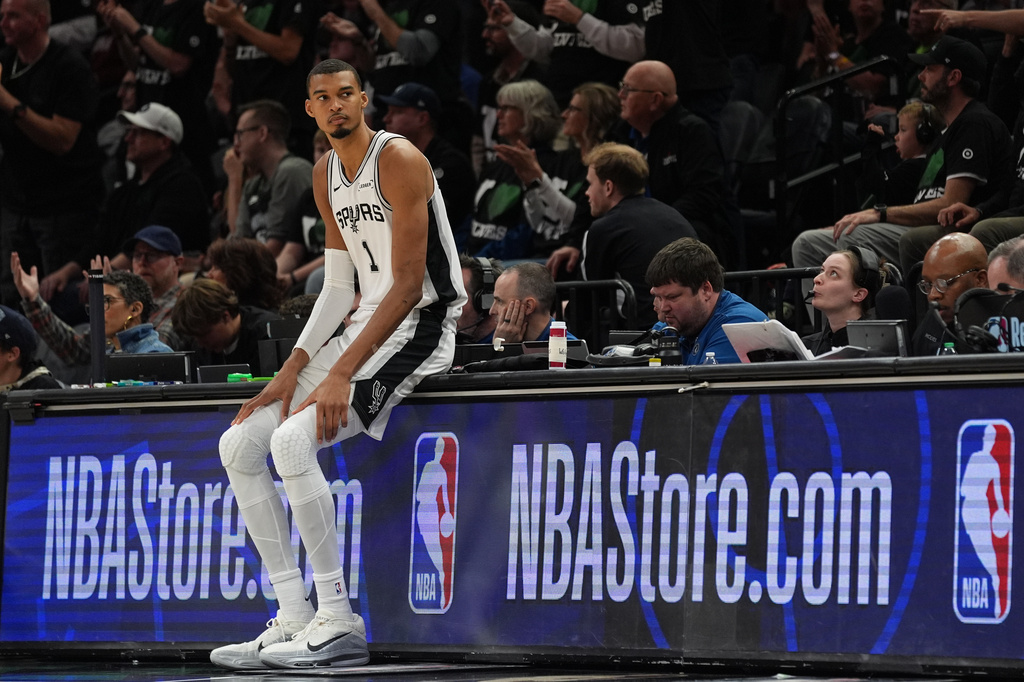 San Antonio Spurs forward Victor Wembanyama (1) waits to reenter the game during the first half of Game 3 of a NBA basketball second-round playoff series against the Minnesota Timberwolves in Minneapolis, Friday, May 8, 2026. (AP Photo/Abbie Parr)