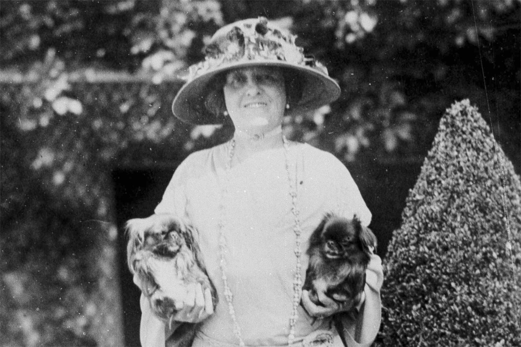 FILE - American author Edith Wharton poses with her dogs in France, 1923. (AP Photo, File)