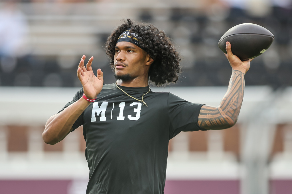 Missouri quarterback Austin Simmons throws during warmups before an NCAA college football game against Mississippi in Starkville, Miss., Saturday, Sept. 26, 2026. (AP Photo/James Pugh)