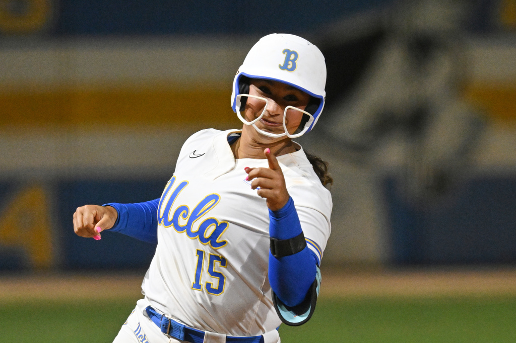 FILE - UCLAs' Jordan Woolery (15) runs the bases during an NCAA softball game on Friday, March 6, 2026, in Los Angeles. (AP Photo/John McCoy, File)