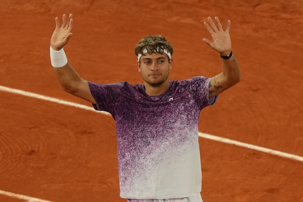 Italy's Flavio Cobolli reacts after winning the quarterfinal tennis match against Canada's Felix Auger-Aliassime at the French Open in Paris, Wednesday, June 3, 2026. (AP Photo/Aurelien Morissard)