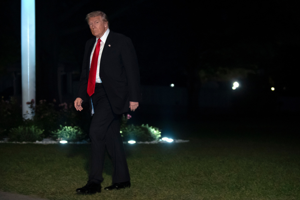 President Donald Trump walks across the South Lawn of the White House, Sunday, Nov. 2, 2025, in Washington, after returning from a trip to Florida. (AP Photo/Mark Schiefelbein)