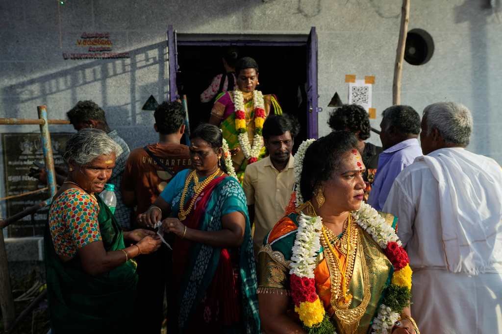 Transgender participants walk out of the Koothandavar temple after symbolically marrying the Hindu god Aravan during the Koovagam festival in Kallakurichi district in the southern Indian state of Tamil Nadu, Tuesday, April 28, 2026. (AP Photo/Mahesh Kumar A.)