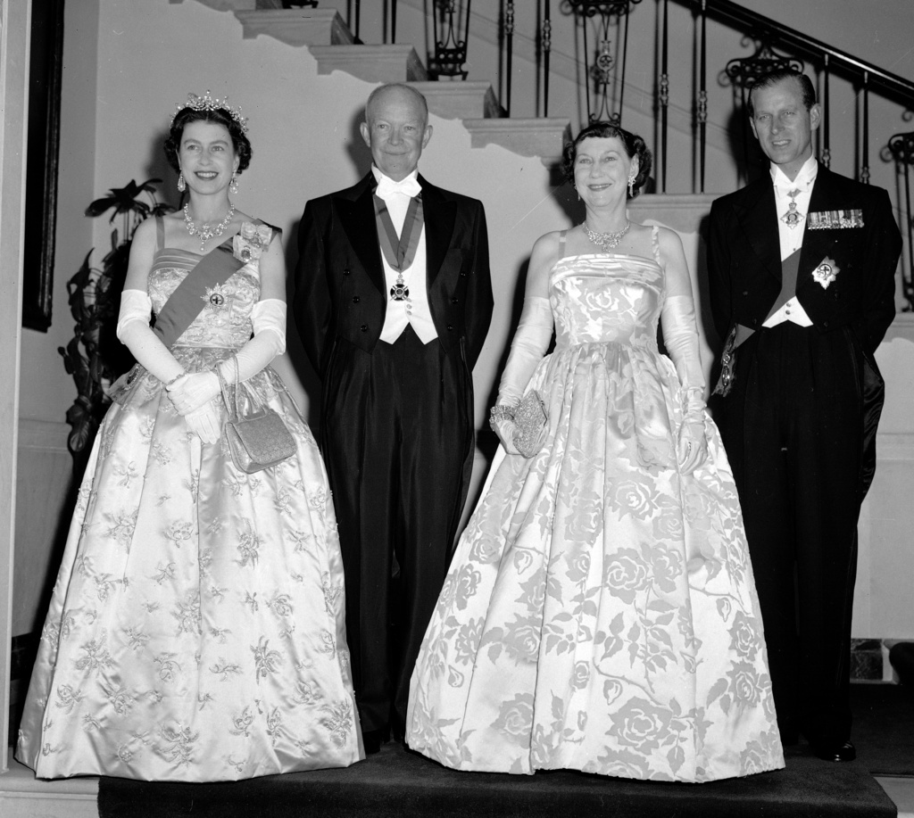 FILE - Britain's Queen Elizabeth II, far left, and her husband, Prince Philip, stand with President Dwight Eisenhower, far right, and first lady Mamie at the White House in Washington, Oct. 17, 1957. (AP Photo, File)