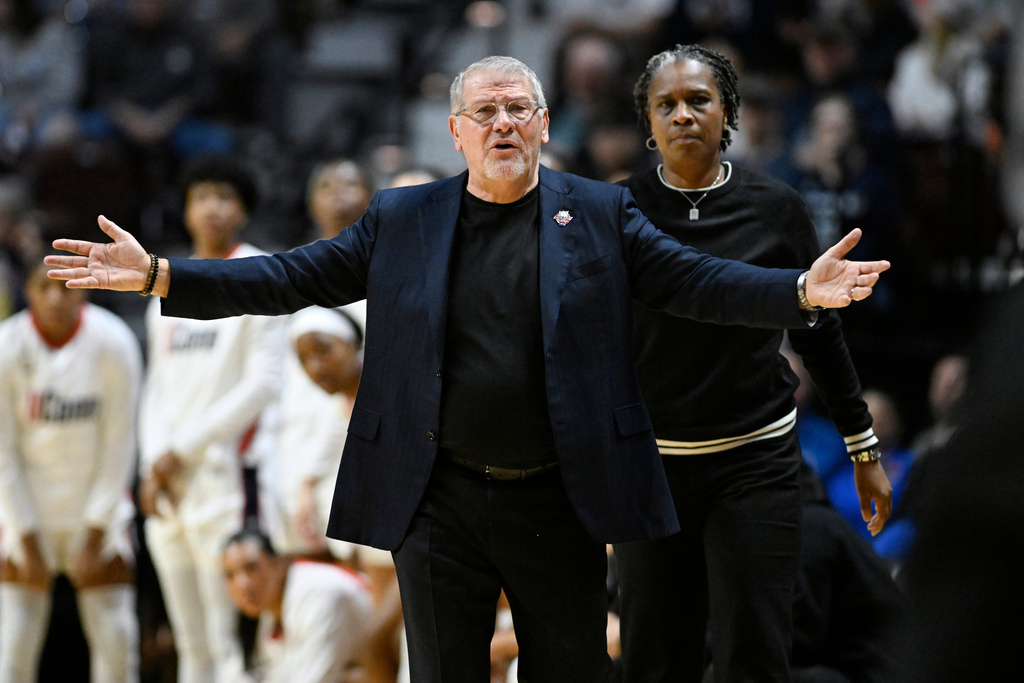 UConn head coach Geno Auriemma gestures toward an official during first half of an NCAA college basketball game against Villanova in the finals of the Big East tournament, Monday, March 9, 2026, in Uncasville, Conn. (AP Photo/Jessica Hill)