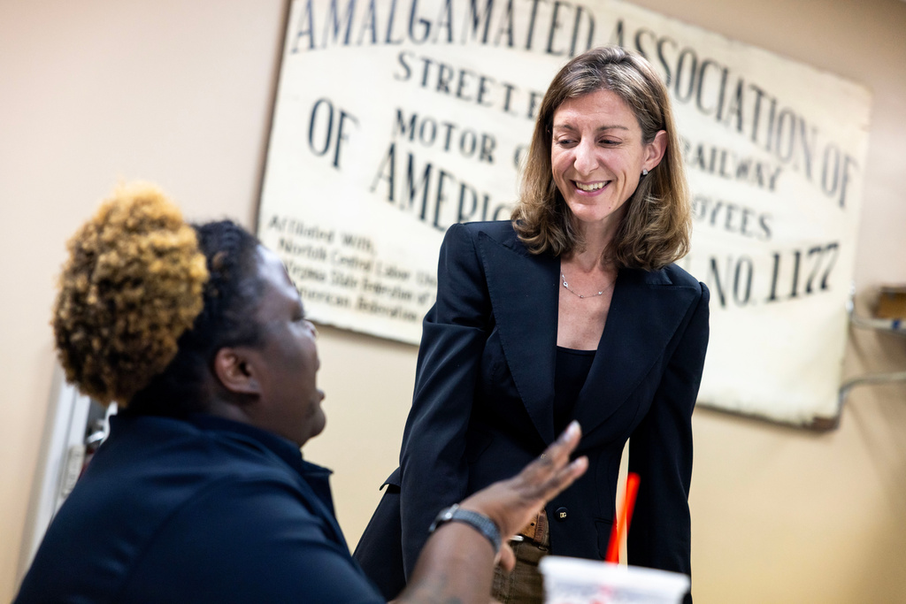 Former Rep. Elaine Luria, D-Va., speaks with Amalgamated Transit Union Local 1177 member Terraine Little on Thursday, July 9, 2026, in Norfolk, Va. (AP Photo/Kendall Warner)