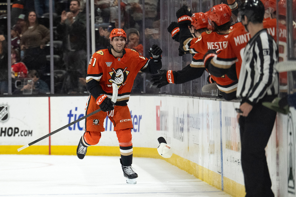 Anaheim Ducks left wing Cutter Gauthier (61) celebrates his goal with the bench during the second period of an NHL hockey game against the Florida Panthers, Tuesday, Nov. 4, 2025, in Anaheim, Calif. (AP Photo/Kyusung Gong)