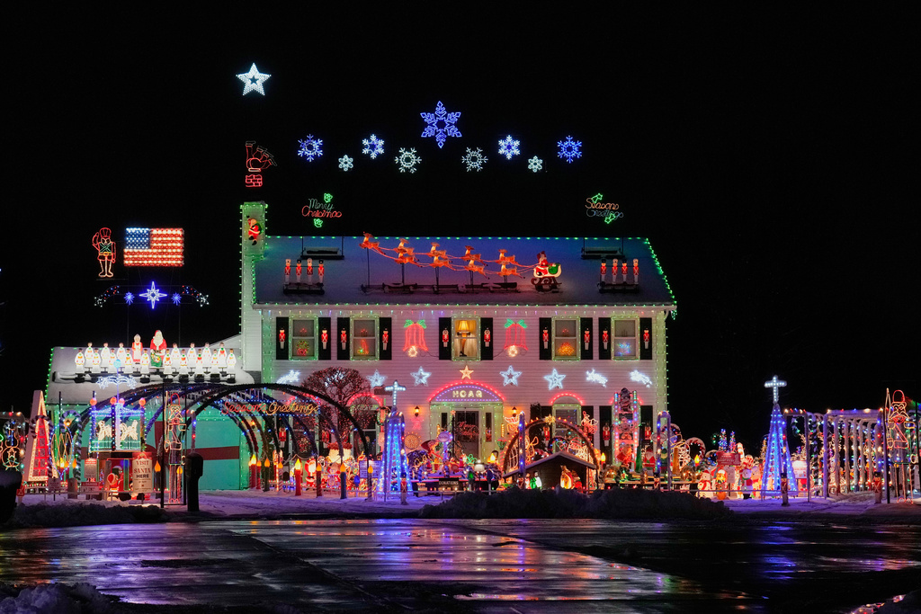 FILE - A home is decked out in holiday lights and Christmas decorations in Strongsville, Ohio, Dec. 2, 2025. (AP Photo/Sue Ogrocki, File)