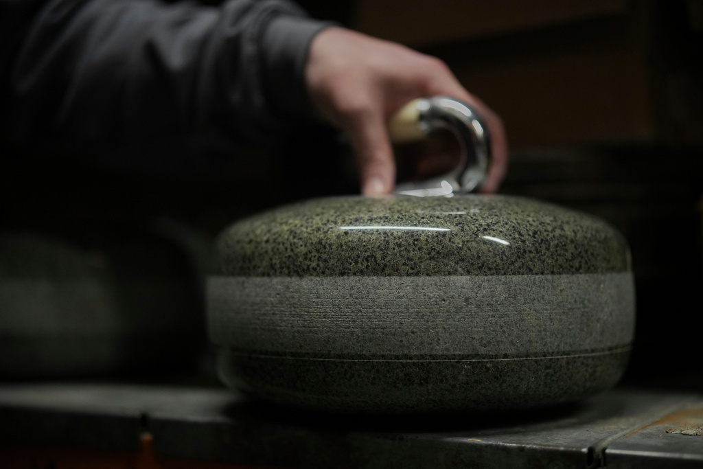 A finished curling stone sits in a store room at Kays Curling stone factory in Mauchline, Scotland, Tuesday, Nov. 11, 2025. (AP Photo/Alastair Grant)