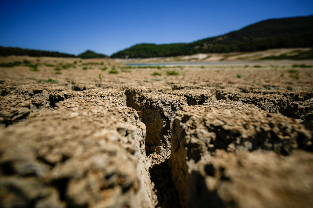 FILE - Fanaco Lake is dry and cracked in Castronovo di Sicilia, central Sicily, Italy, July 17, 2024. (AP Photo/Andrew Medichini, File)