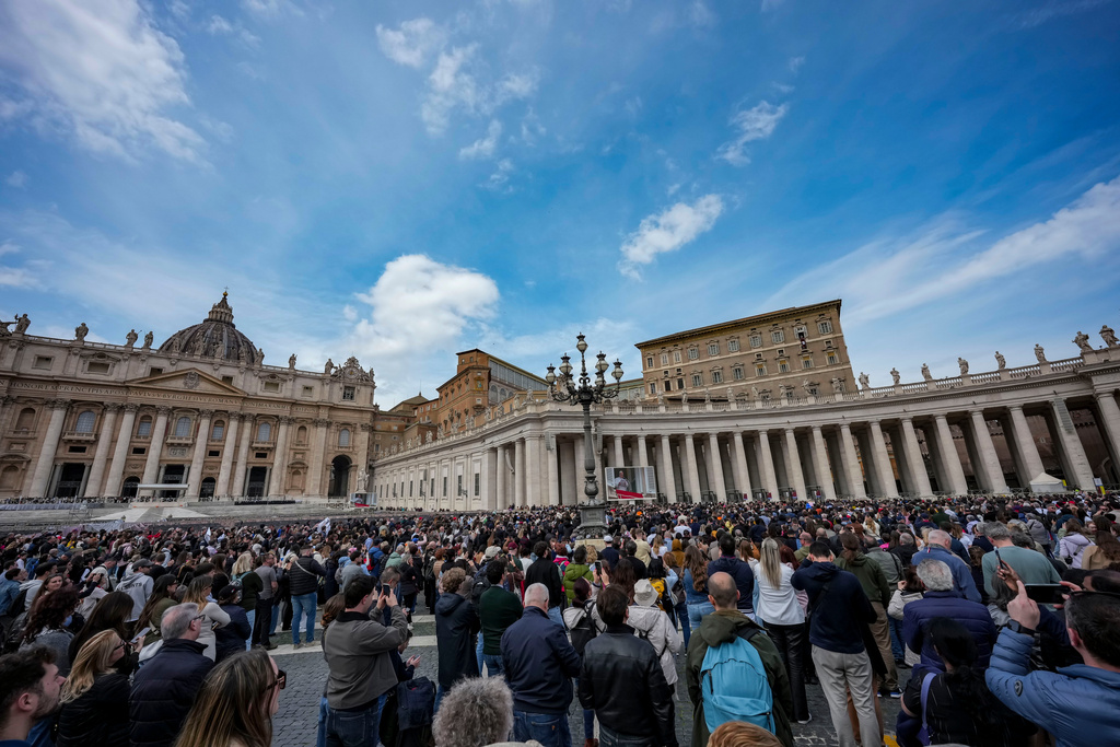 Pope Leo XIV appears at the window of his studio overlooking St. Peter's Square at the Vatican where Catholic faithful and pilgrims gathered for the traditional Sunday blessing at the end of the noon Angelus prayer, Sunday, March 15, 2026. (AP Photo/Andrew Medichini)