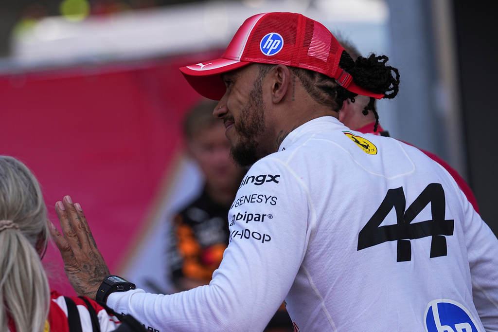 Ferrari driver Lewis Hamilton of Britain smiles after the qualifying session for the Monaco F1 Grand Prix, at the Monaco racetrack, Saturday, June 6, 2026. (AP Photo/Fatima Shbair)