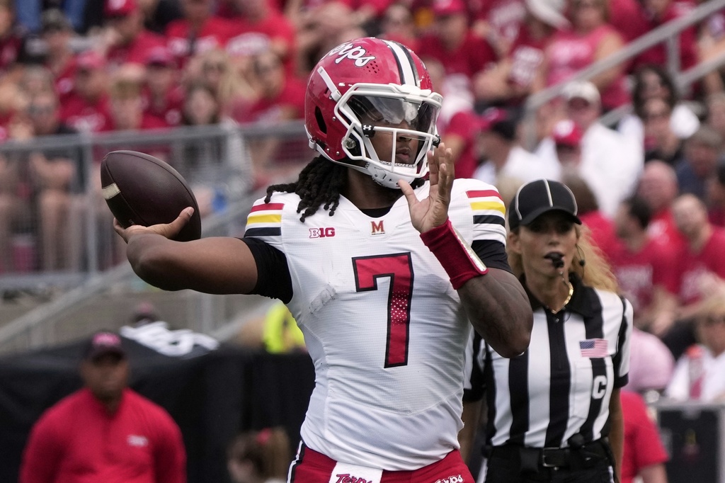 Maryland quarterback Malik Washington throws during the first half of an NCAA college football game against Wisconsin Saturday, Sept. 20, 2025, in Madison, Wis. (AP Photo/Morry Gash)