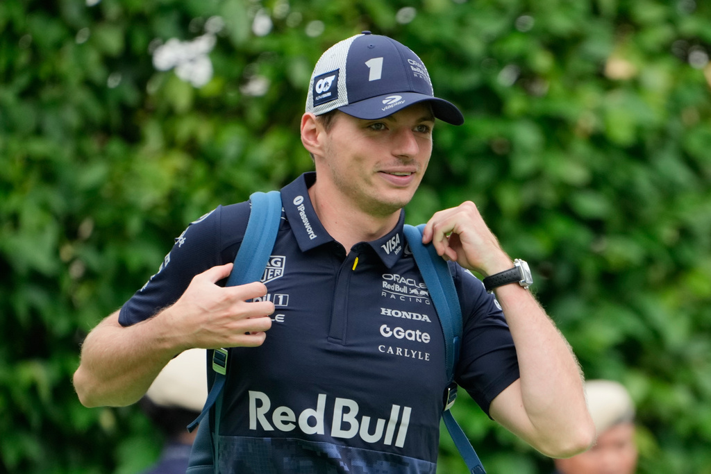 Red Bull driver Max Verstappen of the Netherlands arrives ahead of the first practice session of the Singapore Formula One Grand Prix at the Marina Bay Street Circuit in Singapore, Friday, Oct. 3, 2025. (AP Photo/Vincent Thian)