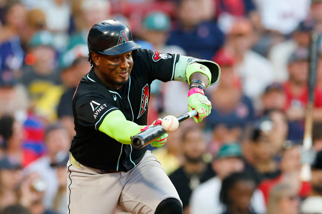 Arizona Diamondbacks' Geraldo Perdomo bunts the ball during the tenth inning of a baseball game against the Boston Red Sox Wednesday, Aug. 19, 2026, in Boston. (AP Photo/CJ Gunther)